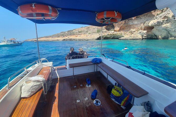 Boat Charters Blue lagoon, Crystal Lagoon, Comino, Malta 4hr trip - San Niklaw Bay closes the Comino circuit