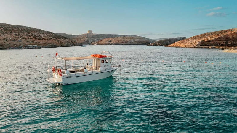 Comino: Blue Lagoon, Crystal Lagoon and Sea Caves Boat Tour - Leaving Ċirkewwa and passing Comino Tower