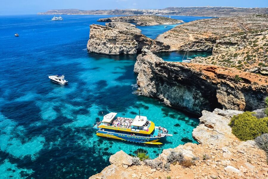 From Bugibba: Blue Lagoon Afternoon Swim with Sunset Cruise - Santa Maria Caves and the sunset return