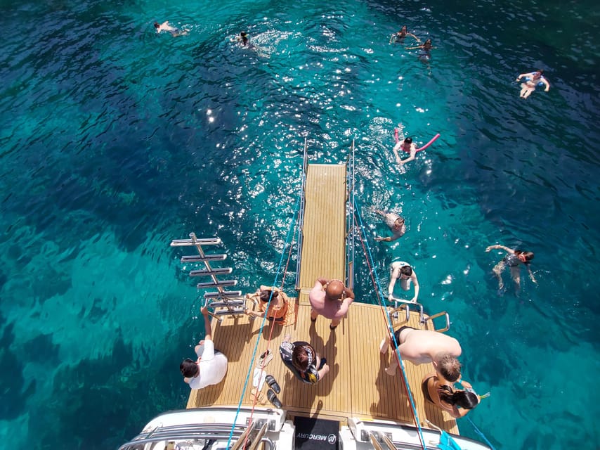 From Mellieha: Three Bay Cruise including the Blue Lagoon - Blue Lagoon: beautiful water, busy shoreline