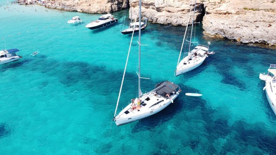 From Valletta: Full Day Private Charter on a Sailing Yacht - Blue Lagoon: the famous stop with a busy reputation