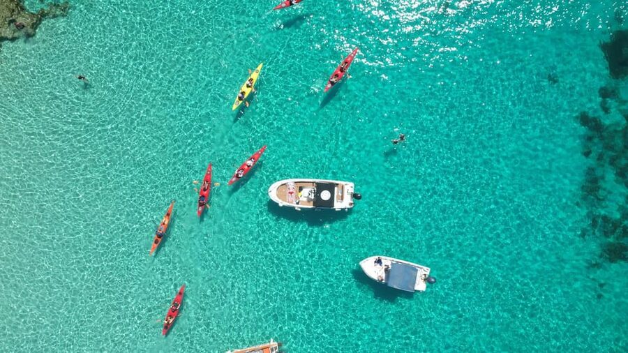 Gozo: Comino and Blue Lagoon Guided Kayaking Adventure - Crossing toward Comino by kayak