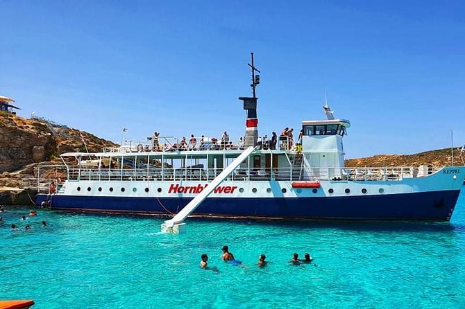 Malta: Comino, Blue Lagoon & Caves - swim, snorkel & slide - Food, music, and the boat atmosphere