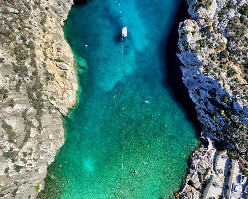 Malta: Private Sunset Boat Trip to Comino and Blue Lagoon - Caves, cliffs, and film locations around Comino