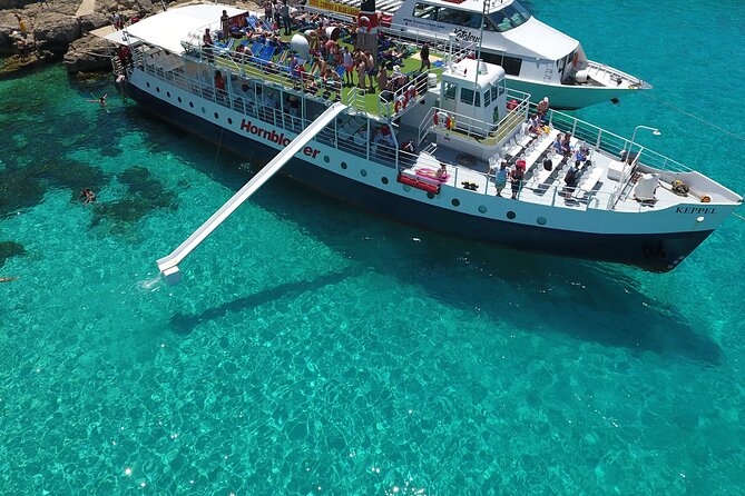 Malta Sunset Boat Tour: Bugibba to Comino Blue Lagoon Cruise - Sunset, food, and the return under the stars