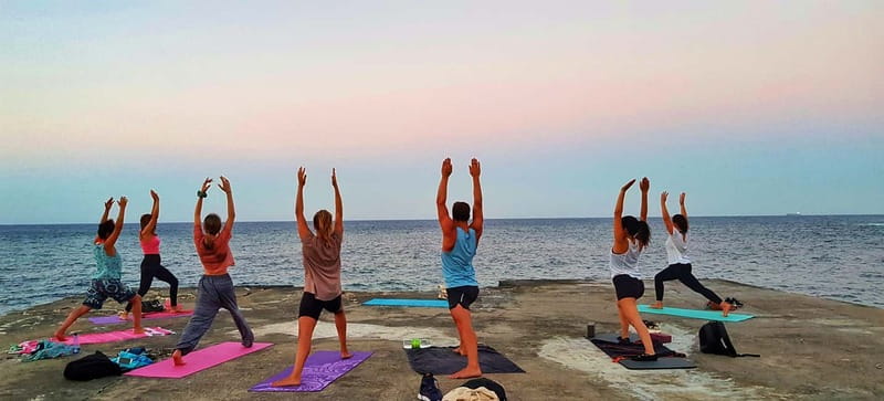Sliema: Beach Yoga Class with Swimming - Key points at a glance